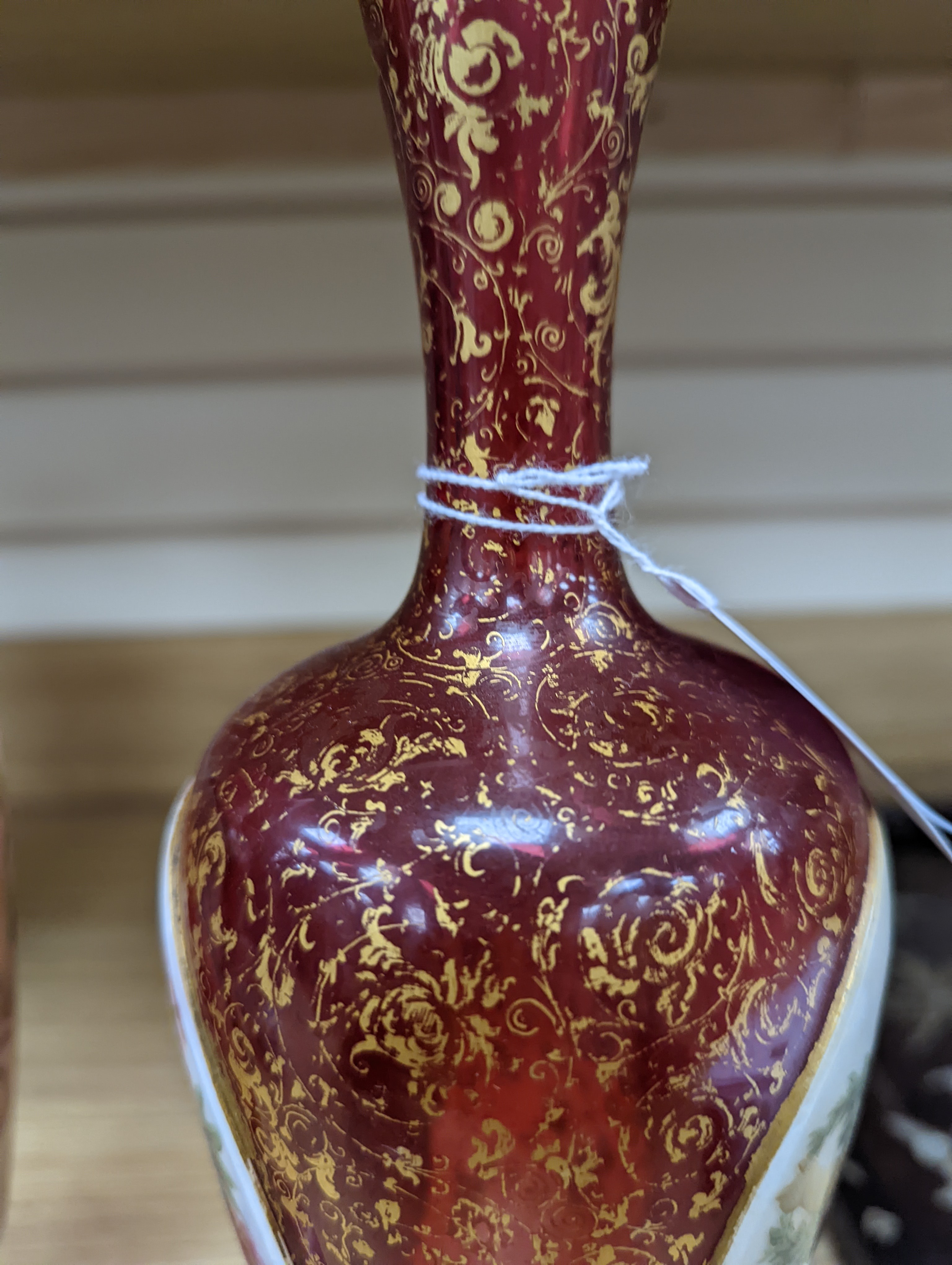 A pair of 19th century Bohemian enamelled and overlaid ruby glass vases 36cm